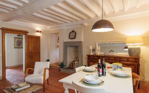 Appartamento Mancini: Table, Furniture, Property, Building, Wood, Picture Frame, Chair, Lighting, Cabinetry, Interior Design