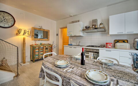 Casa Riva: Property, Furniture, Cabinetry, Countertop, Wood, Tableware, Interior Design, Lighting, Kitchen, Shelving