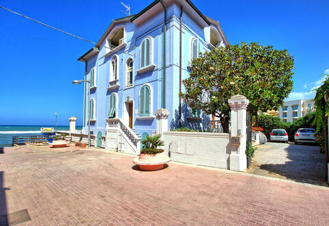 Casa Riva: Sky, Plant, Property, Building, Water, Window, Tree, Residential Area, Real Estate, Facade