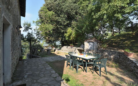 Villa Antelminelli: Plant, Furniture, Table, Sky, Tree, Chair, Outdoor Furniture, Shade, Flowerpot, Building