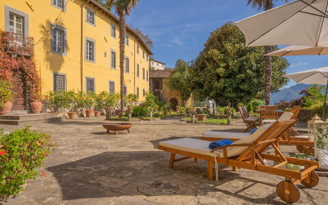 Villa In Garfagnana: Plant, Furniture, Building, Sky, Window, Azure, Outdoor Bench, Outdoor Furniture, Shade, Tree