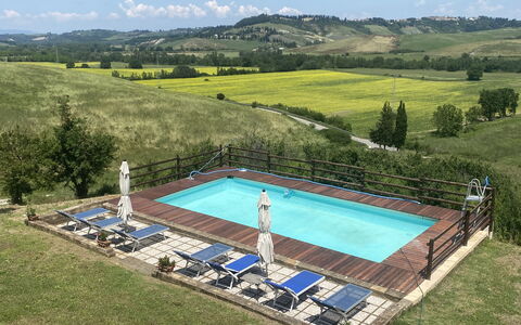 Podere La Sterza: Water, Sky, Plant, Swimming Pool, Tree, Cloud, Outdoor Furniture, Natural Landscape, Rectangle, Chair