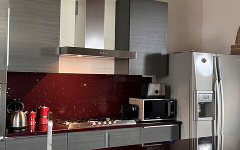 Villa Monticello: Cabinetry, Countertop, Kitchen, Building, Wood, Interior Design, Kitchen Stove, Kitchen Appliance, Flooring, Floor