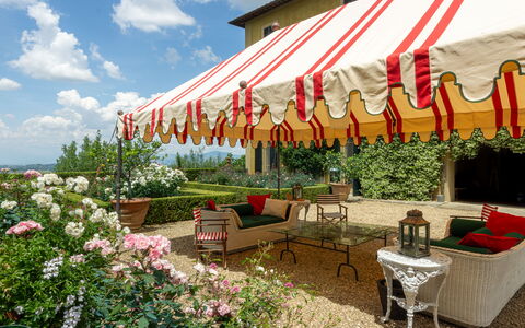 Castello Di Quarate: Flower, Plant, Furniture, Cloud, Table, Nature, Sky, Shade, Outdoor Furniture, Chair