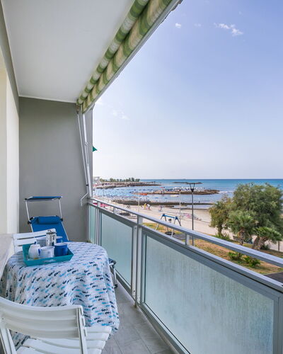 Massimo Beach House: Cloud, Sky, Plant, Arecales, Shade, Tree, Coastal And Oceanic Landforms, Leisure, Terrestrial Plant, Boat