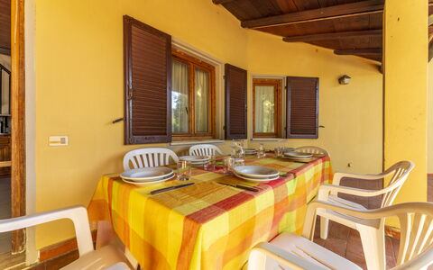Argentario Giannella Apartment- Orbetello, Toscana: Table, Property, Tableware, Building, Interior Design, Wood, Architecture, Window, Chair, Plate