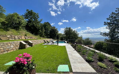 Villa Luana: Garden, Lawn, Landscaping, Swimming Pool, Backyard, Shade, Yard, Flagstone, Park, Walkway