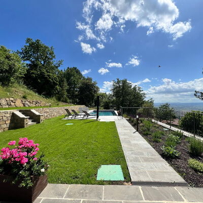 Villa Luana: Garden, Lawn, Landscaping, Swimming Pool, Backyard, Shade, Yard, Flagstone, Park, Walkway