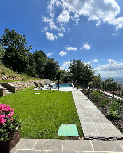 Villa Luana: Garden, Lawn, Landscaping, Swimming Pool, Backyard, Shade, Yard, Flagstone, Park, Walkway