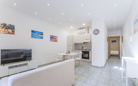 Casa Verdi,near The Beach - Viareggio, Toscana: Building, Furniture, Couch, Table, Houseplant, House, Television, Interior Design, Living Room, Floor