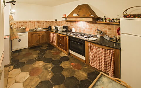 Palazzo Trasimeno: Countertop, Cabinetry, Property, Kitchen, Kitchen Stove, Wood, Lighting, Interior Design, Flooring, Floor