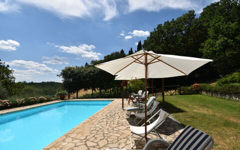 Podere Le Muricce: Cloud, Water, Sky, Plant, Swimming Pool, Umbrella, Tree, Shade, Outdoor Furniture, Chair
