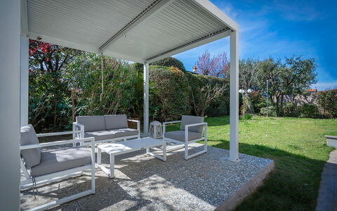 Villa Le Fontanelle In Forte Dei Marmi With Ac: Plant, Sky, Shade, Outdoor Furniture, Tree, Chair, Real Estate, Residential Area, Landscape, Leisure
