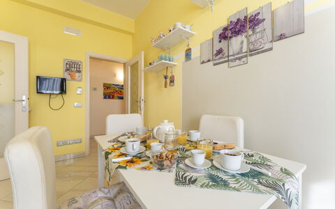 Leandro's House Near Thermal Baths: Property, Azure, Table, Building, Lighting, Interior Design, Yellow, Tableware, Floor, Picture Frame