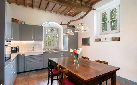 Casa Mirandola: Table, Furniture, Cabinetry, Property, Window, Countertop, Wood, Interior Design, Lighting, Chair