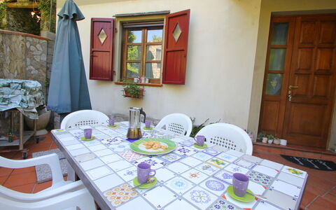 Villa La Rocca: Table, Furniture, Property, Purple, Door, Textile, Chair, Interior Design, Architecture, Plant