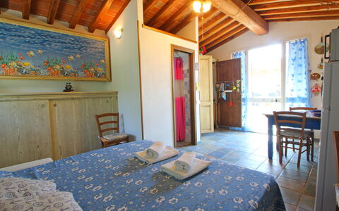 La Casetta: Furniture, Property, Table, Wood, Interior Design, Floor, Flooring, Wall, Window, Real Estate