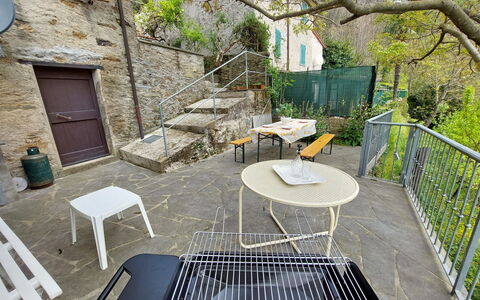 Casa Le Grotte: Table, Property, Furniture, Building, Plant, Window, Outdoor Table, Outdoor Furniture, Lighting, Architecture