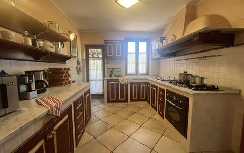 Maremma Retreat: Countertop, Cabinetry, Wood, Kitchen, Interior Design, Kitchen Stove, Lighting, Architecture, Kitchen Appliance, Floor