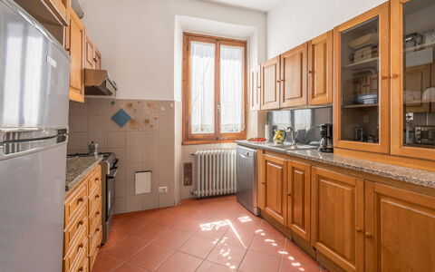 Cascine Apartment In Florence: Kitchen, Countertop, Wood, Flooring, Kitchen Appliance, Cabinetry, Interior Design, Major Appliance, Ceiling, Floor