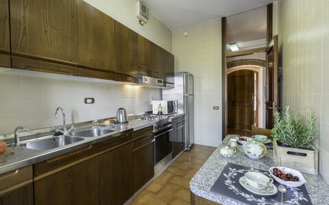 Casa Martina, Piazza Delle Erbe, San Gimignano: Kitchen, Kitchen Appliance, Countertop, Major Appliance, Flooring, Interior Design, Cabinetry, Kitchen Sink, Floor, Home Appliance