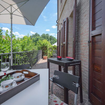 Torri 15 Holiday Home: Sky, Building, Property, Table, Furniture, Cloud, Tableware, Window, Architecture, Flowerpot