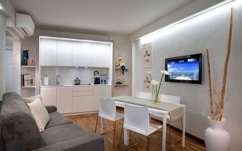 Boheme With Beach & Breakfast Included: Table, Furniture, Couch, Picture Frame, Building, Houseplant, Interior Design, Floor, Shelf, Flooring