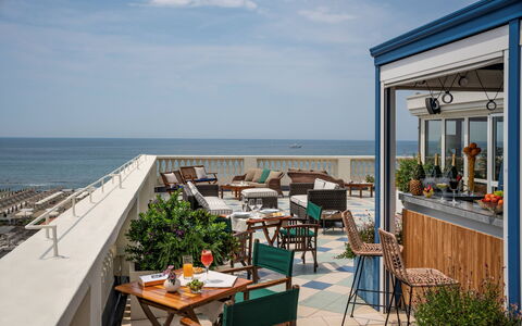 Tosca With Beach & Breakfast Included: Sky, Table, Water, Furniture, Cloud, Building, Azure, Plant, Chair, Outdoor Furniture