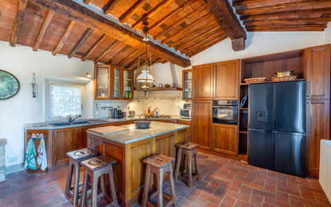 Villa Pietrafitta: Cabinetry, Furniture, Wood, Table, Kitchen, Interior Design, Countertop, Kitchen Appliance, Wood Stain, Floor