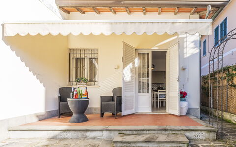 Casa Liliana Ac, Wifi, Forte Dei Marmi: Door, Home, Flowerpot, Furniture, Porch, Awning, Houseplant, Chair, Outdoor Structure, Outdoor Furniture