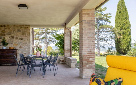 Il Pino Apartment: Furniture, Chair, Outdoor Furniture, Shade, Couch, Wood Stain, Porch, Living Room, Landscaping