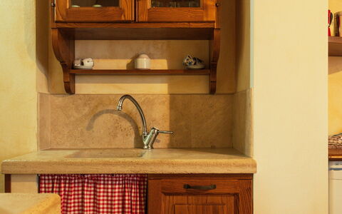 Il Noceto: Wood, Flooring, Furniture, Cabinetry, Interior Design, Kitchen, Countertop, Floor, Brown, Cupboard