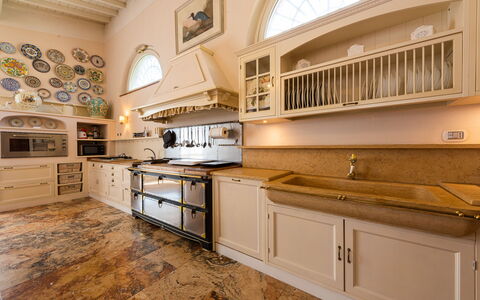Villa Yvonne: Kitchen, Countertop, Interior Design, Furniture, Cabinetry, Flooring, Wood, Kitchen Appliance, Kitchen Stove, Ceiling