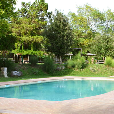 Appartamento La Torretta Di Pietra, Wifi, Perugia: Swimming Pool, Tree, Resort, Shade, Garden, Outdoor Furniture, Leisure, Backyard, Landscaping, Water Feature