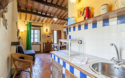 Appartamento Rustico, Wifi, Perugia: Furniture, Chair, Wood Stain, Countertop, Hardwood, Kitchen & Dining Room Table, Kitchen, Houseplant, Cabinetry, Tile