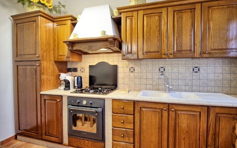 Villa Portole Due: Cabinetry, Kitchen, Countertop, Wood, Major Appliance, Flooring, Interior Design, Kitchen Appliance, Furniture, Cupboard