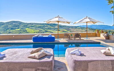 Villa Sagrantino: Blue, Swimming Pool, Resort, Outdoor Furniture, Umbrella, Mountain Range, Sunlounger, Hotel, Villa, Eco Hotel