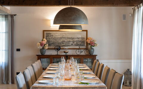 Villa Cortona: Eco-Sustainable Luxury Estate with: Furniture, Interior Design, Table, Wood, Kitchen & Dining Room Table, Dining Room, Light Fixture, Ceiling, Chair, Flooring