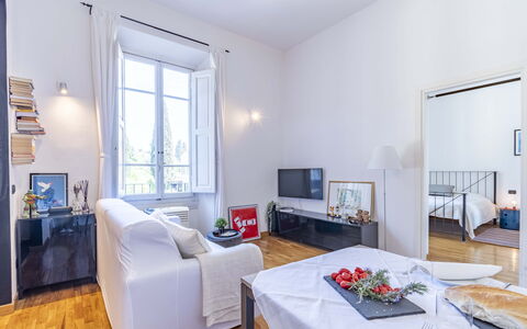 Green Suite Florence: Furniture, Interior Design, Flooring, Floor, Room, Ceiling, Couch, Living Room, Apartment, Table