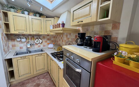 Anna: Kitchen Appliance, Kitchen, Countertop, Major Appliance, Kitchen Stove, Cabinetry, Wood, Flooring, Furniture, Interior Design