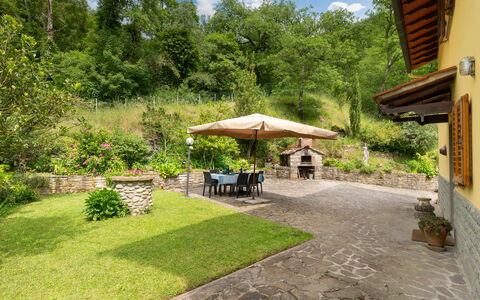 Villa Fornaci: Furniture, Flagstone, Garden, Outdoor Furniture, Backyard, Shade, Landscaping, Chair, Eco Hotel, Yard