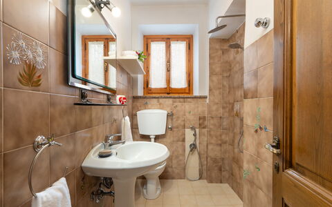 Villa Fornaci: Bathroom Sink, Bathroom, Toilet Seat, Sink, Plumbing Fixture, Toilet, Flooring, Interior Design, Tap, Floor