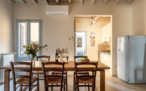 San Cristofano Blu Apartment Santa Croce, Florence: Furniture, Flooring, Interior Design, Wood, Floor, Table, Kitchen & Dining Room Table, Chair, Ceiling, Dining Room