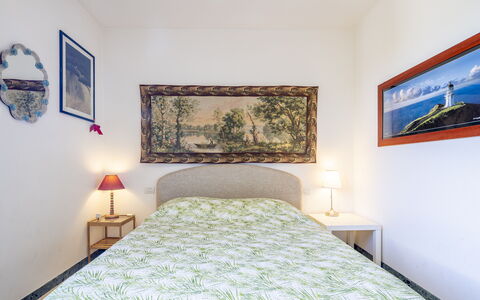 Attico Marino: Bed, Furniture, Bedroom, Interior Design, Wall, Floor, Bedding, Bed Sheet, Flooring, Wood