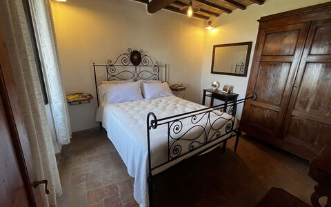 Appartamento Del Mercato: Wall, Flooring, Furniture, Floor, Bedroom, Room, Bed, Bed Frame, Picture Frame, Hardwood