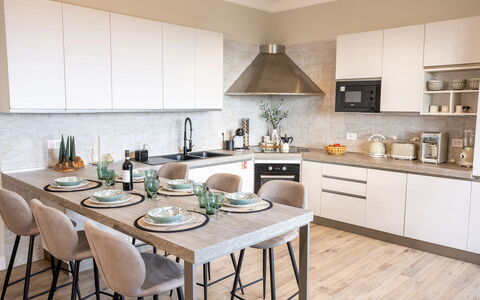 Casa Coccinella: Furniture, Interior Design, Kitchen, Flooring, Countertop, Wood, Chair, Cabinetry, Kitchen Appliance, Tableware