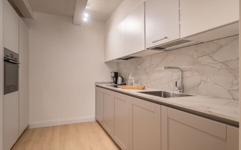 Elegant Apartments Near the Duomo: Kitchen, Countertop, Flooring, Wood, Interior Design, Kitchen Appliance, Cabinetry, Floor, Major Appliance, Ceiling