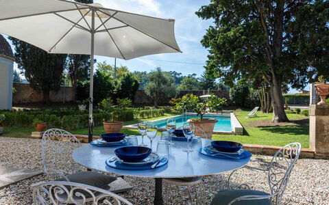Villa Tambellini De Fondra: Furniture, Outdoor Furniture, Chair, Table, Outdoor Table, Garden, Umbrella, Kitchen & Dining Room Table, Shade, Flowerpot
