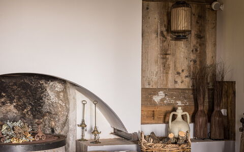 Villa Chiovada: Furniture, Flooring, Interior Design, Floor, Room, Natural Material, Hearth, Living Room, Chair, Hardwood