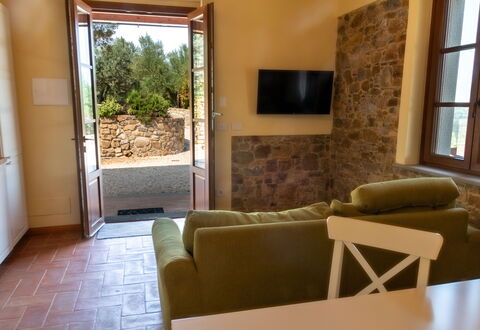 Marina's Lodge: Wall, Furniture, Flooring, Interior Design, Floor, Table, Room, Chair, Living Room, Ceiling